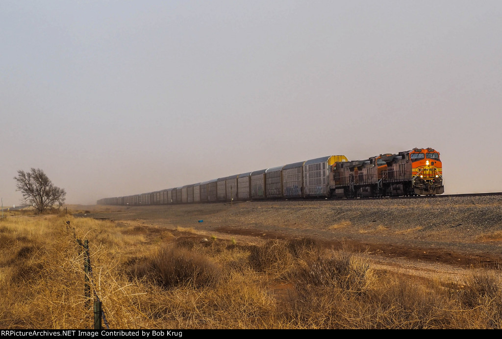 BNSF 4759 leads westbound autoracks through a dust storm